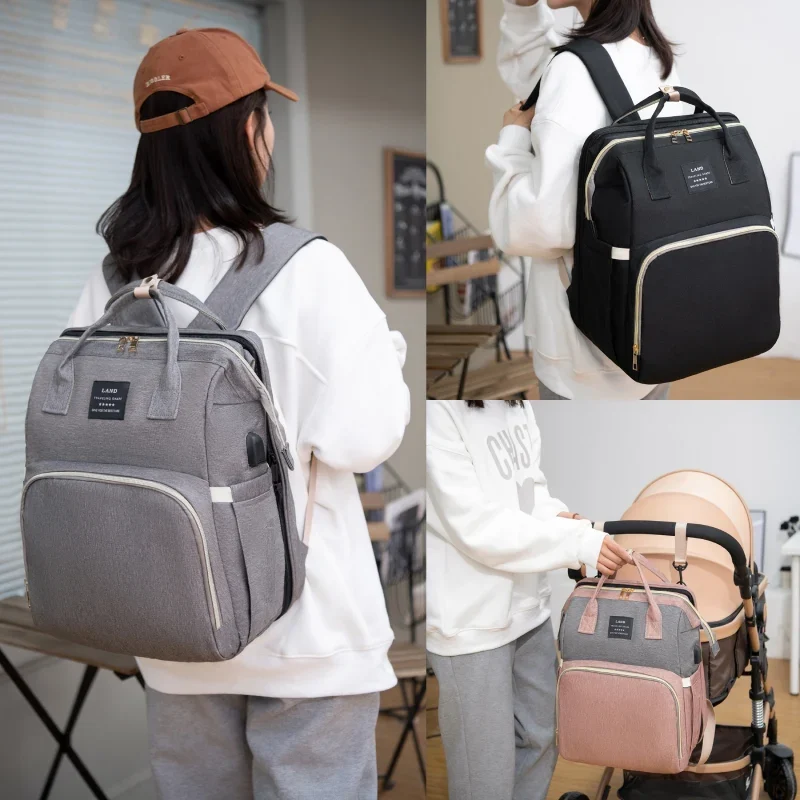 woman wearing her diaper changing rucksack and installing the bag on the stroller rucksack backpack